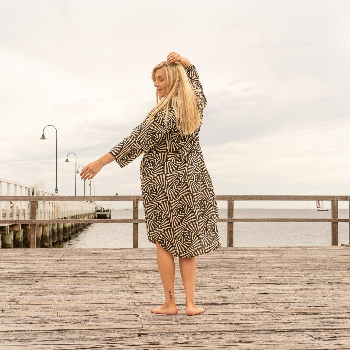 Full-length neutral-tone linen dress