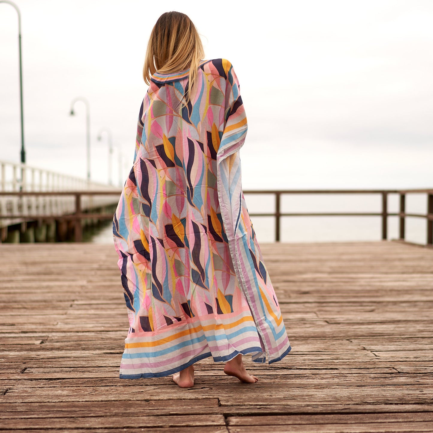 Elegant blue kaftan with flowing silhouette
