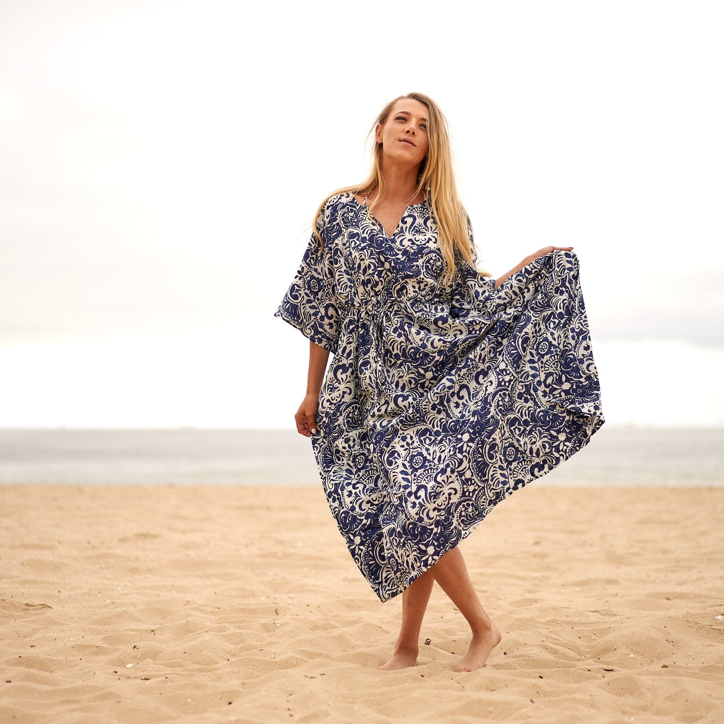Model in flowing kaftan dress