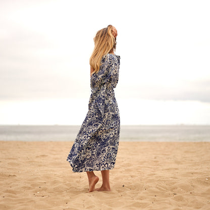 Model in flowing kaftan dress