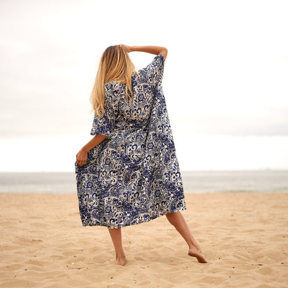 Model in flowing kaftan dress