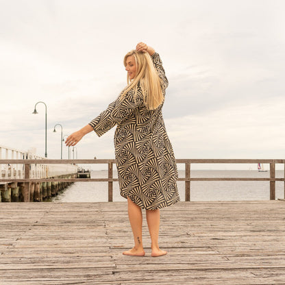 Full-length neutral-tone linen dress