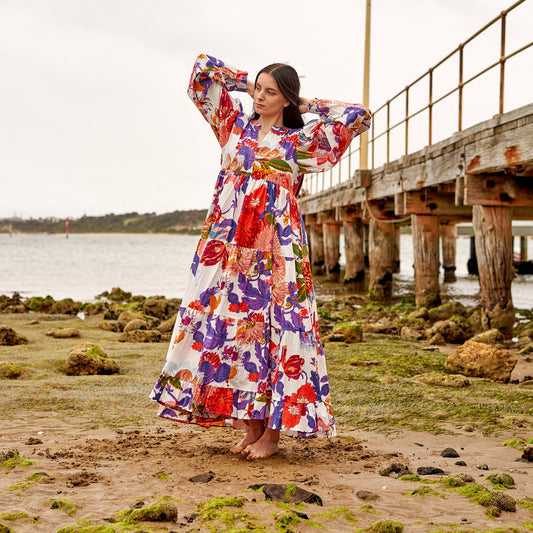 Flowing white maxi dress with delicate floral patterns
