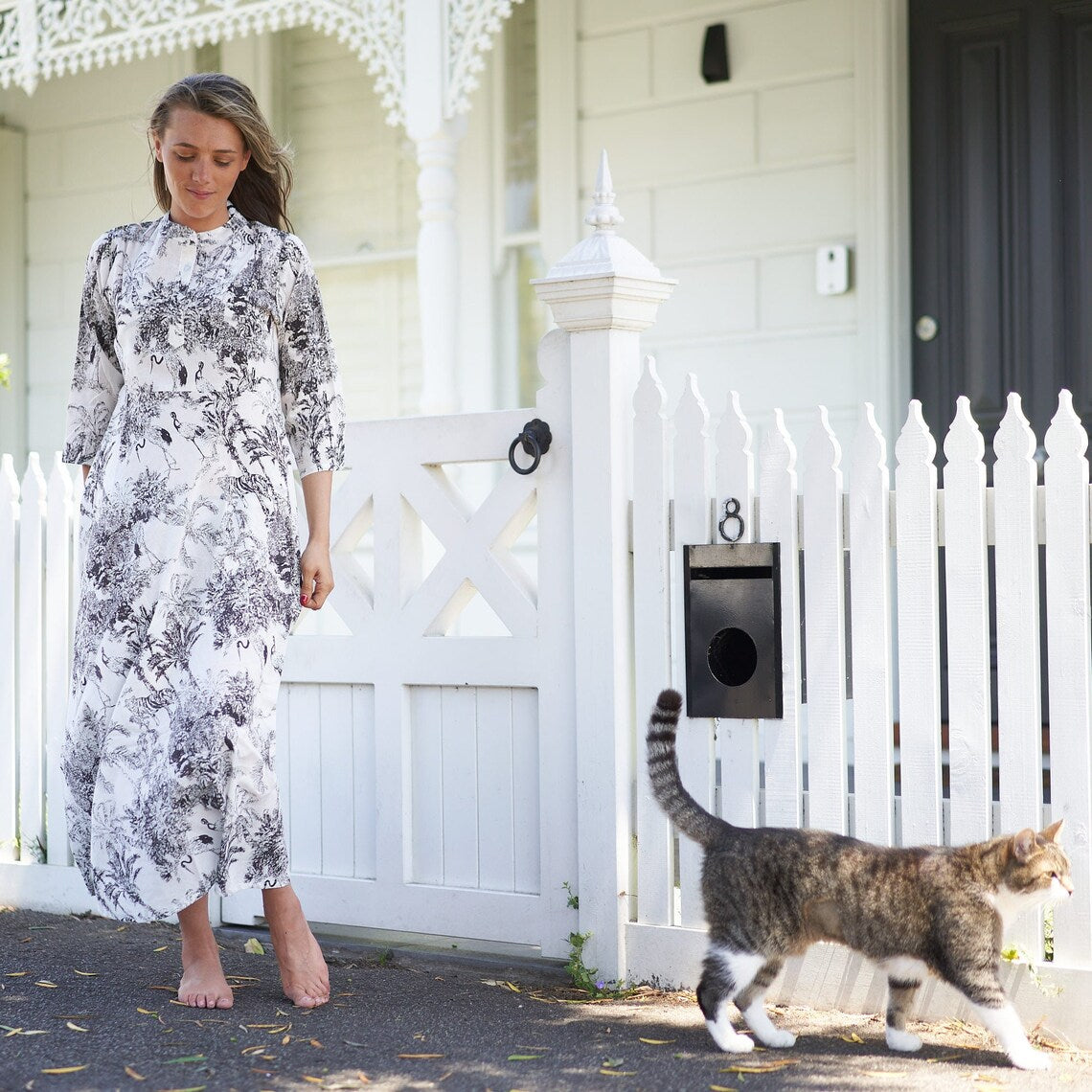 Elegant black floral dress with a flowing silhouette
