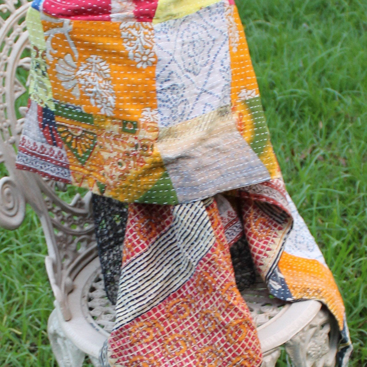 Soft pink scarf with delicate floral patterns

