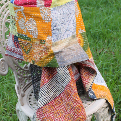 Soft pink scarf with delicate floral patterns

